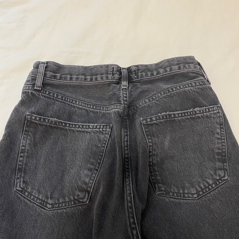 90’s high rise agolde jeans in black and dark wash blue.